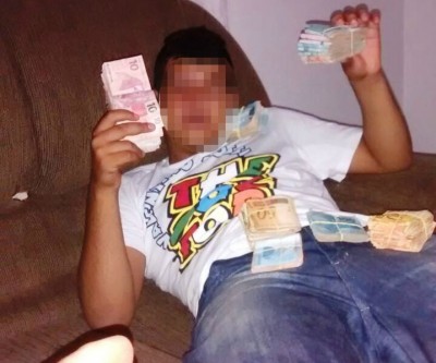 Estudante apreendido com arma ostentava dinheiro nas redes sociais 